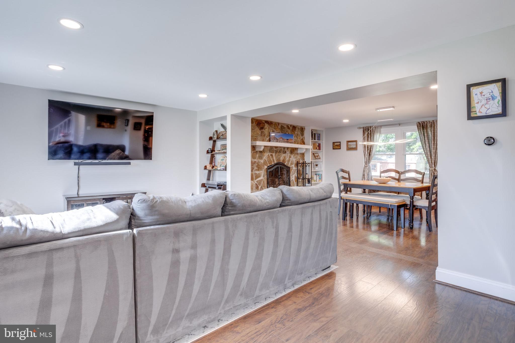 7114 Sterling Grove Drive Springfield, VA 22150 - Photo 13 of 55 a living room with furniture and a flat screen tv