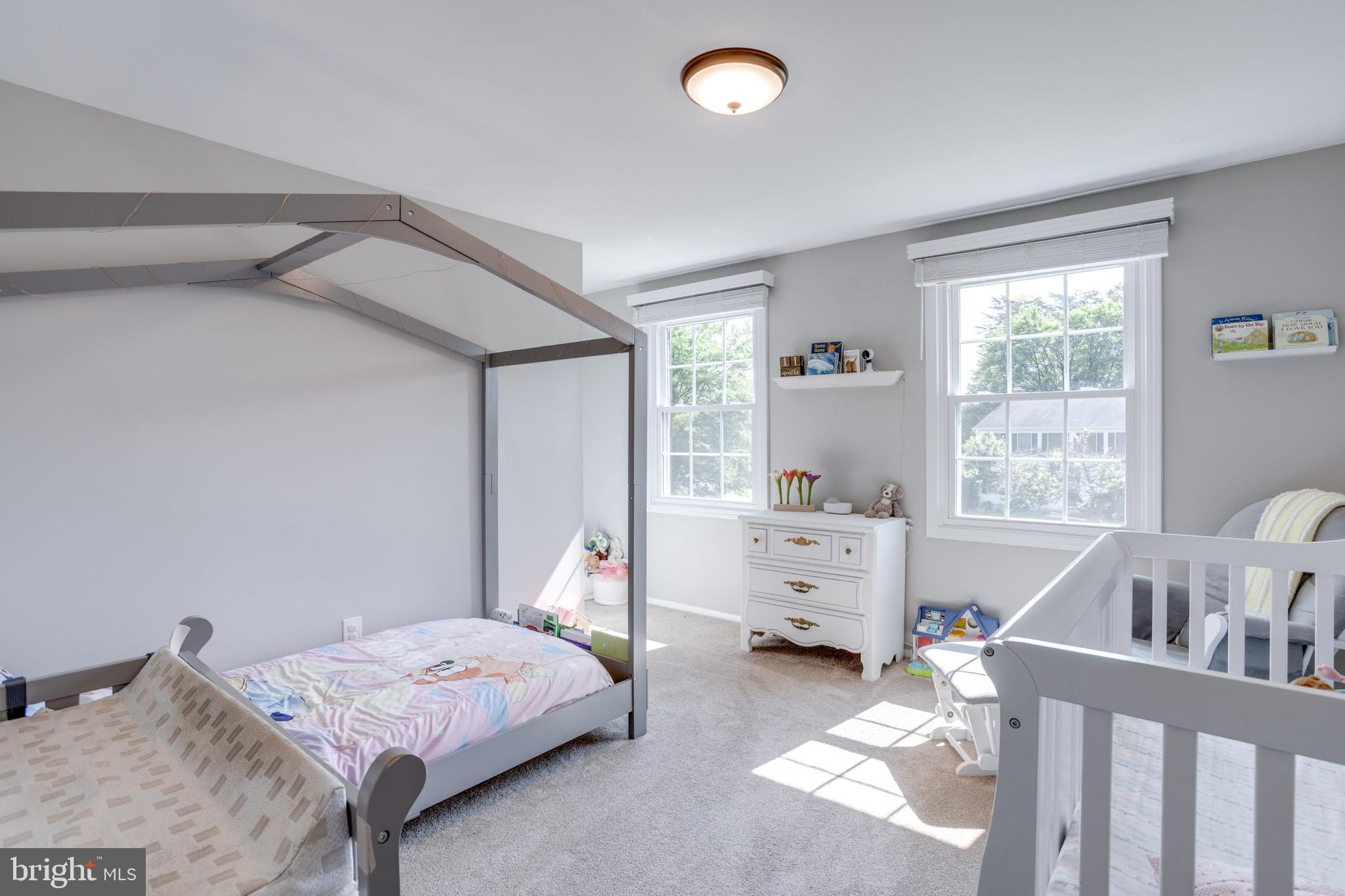 7114 Sterling Grove Drive Springfield, VA 22150 - Photo 27 of 55 a bedroom with a bed and a window
