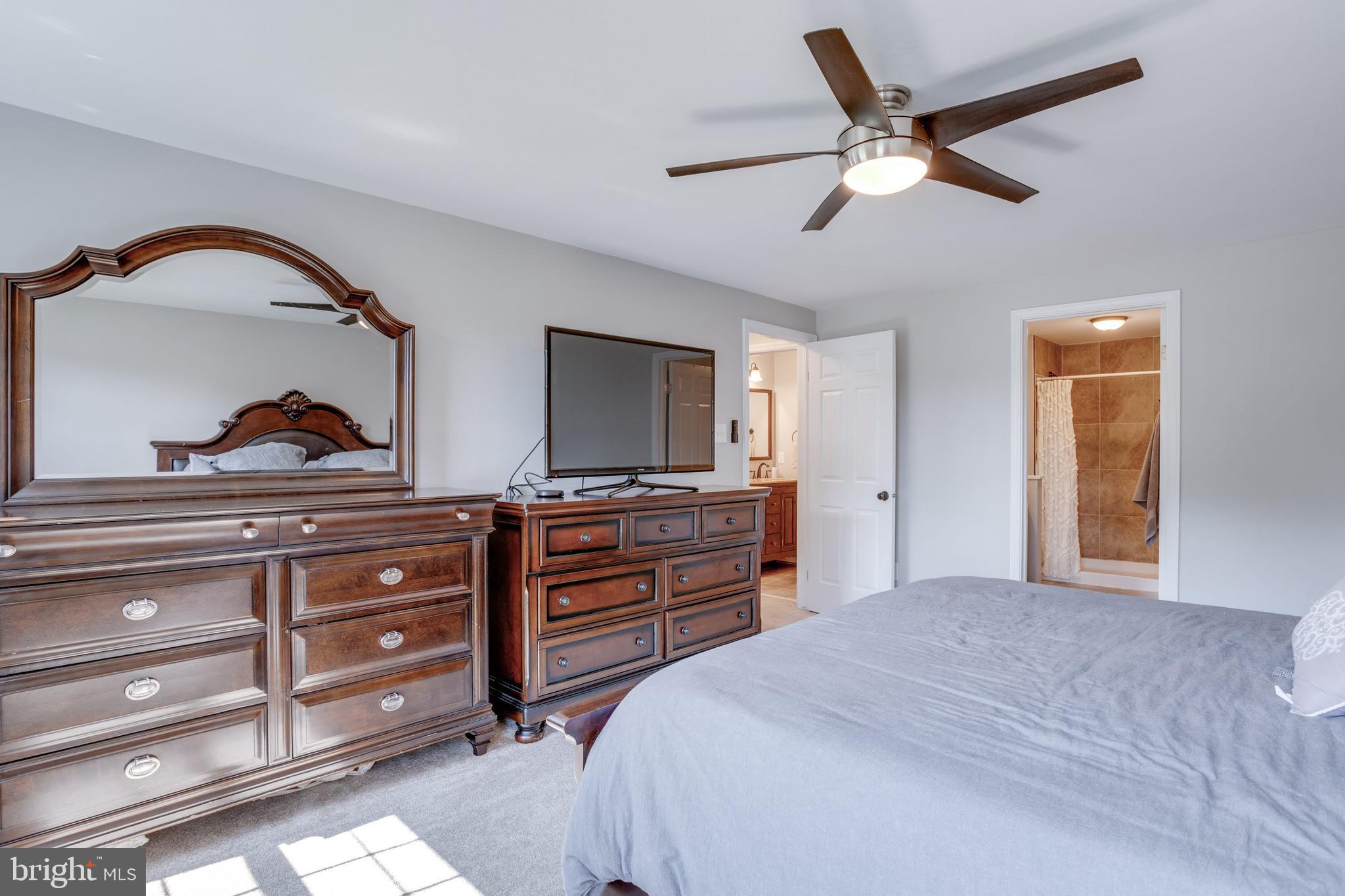7114 Sterling Grove Drive Springfield, VA 22150 - Photo 31 of 55 a bedroom with a bed and a dresser
