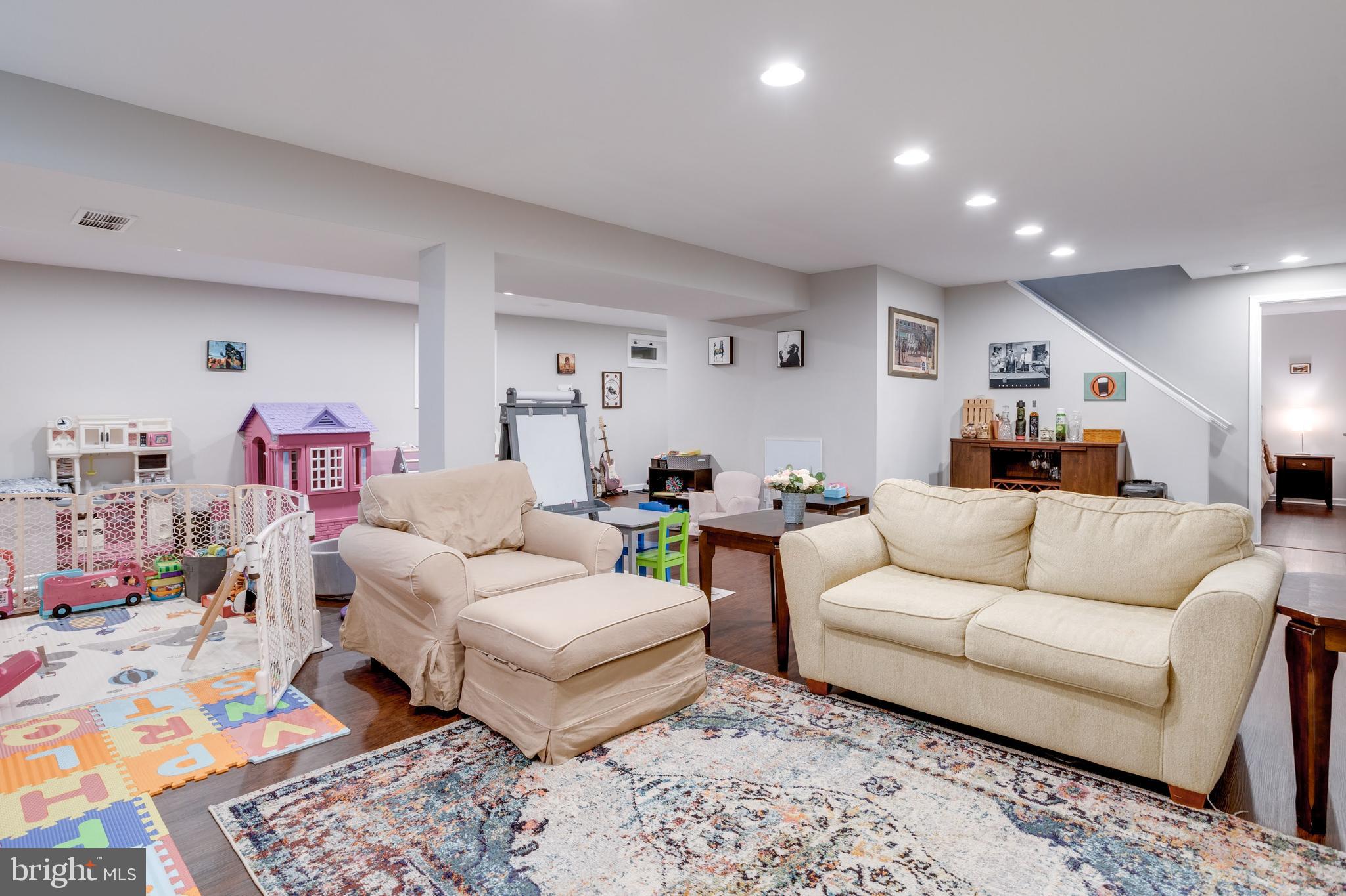 7114 Sterling Grove Drive Springfield, VA 22150 - Photo 41 of 55 a living room with furniture and wooden floor