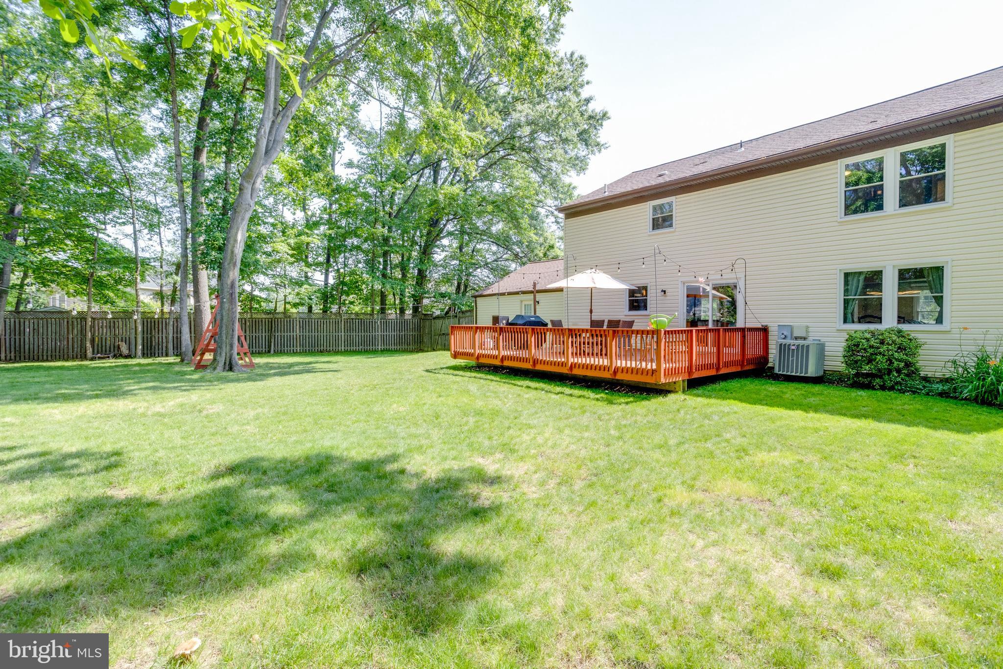 7114 Sterling Grove Drive Springfield, VA 22150 - Photo 45 of 55 a front view of house with yard and seating area