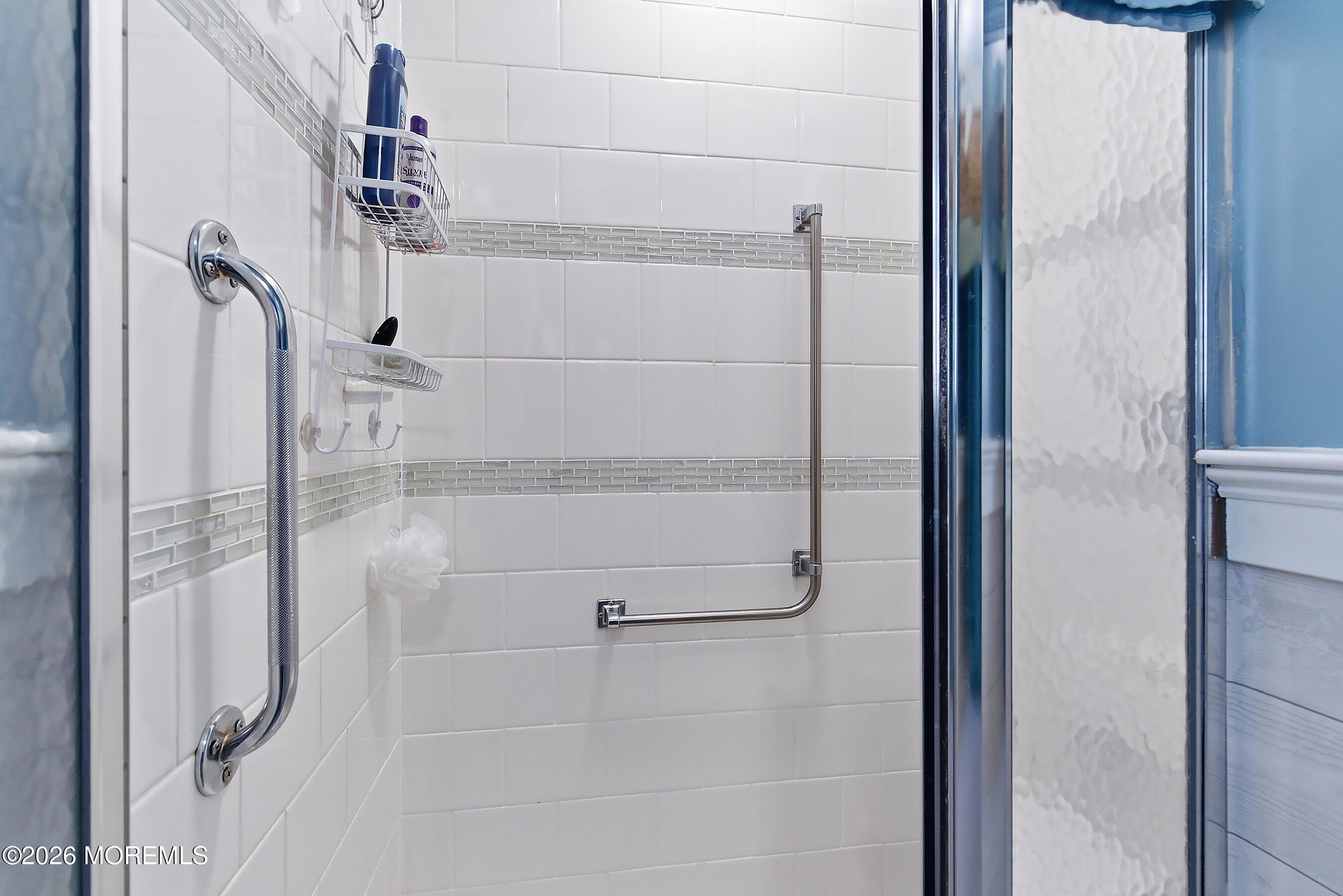 27 Amesbury Road, Unit 64 Whiting, NJ 08759 - Photo 28 of 50 a bathroom with a shower