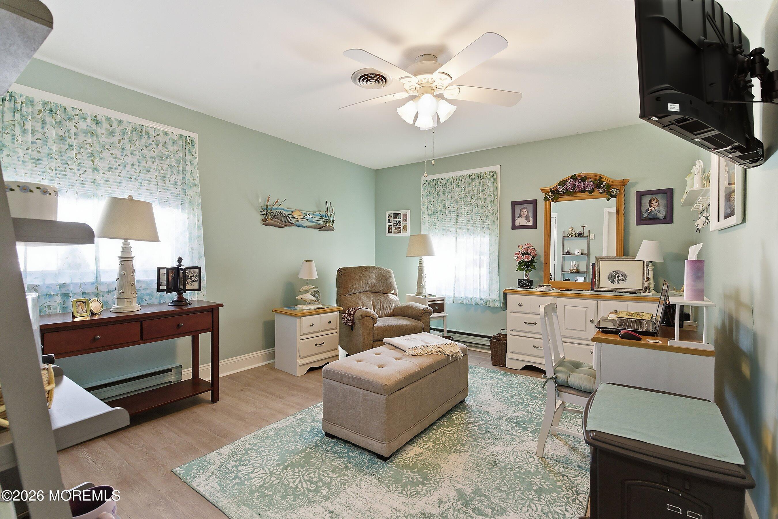 27 Amesbury Road, Unit 64 Whiting, NJ 08759 - Photo 31 of 50 a living room with furniture and a flat screen tv