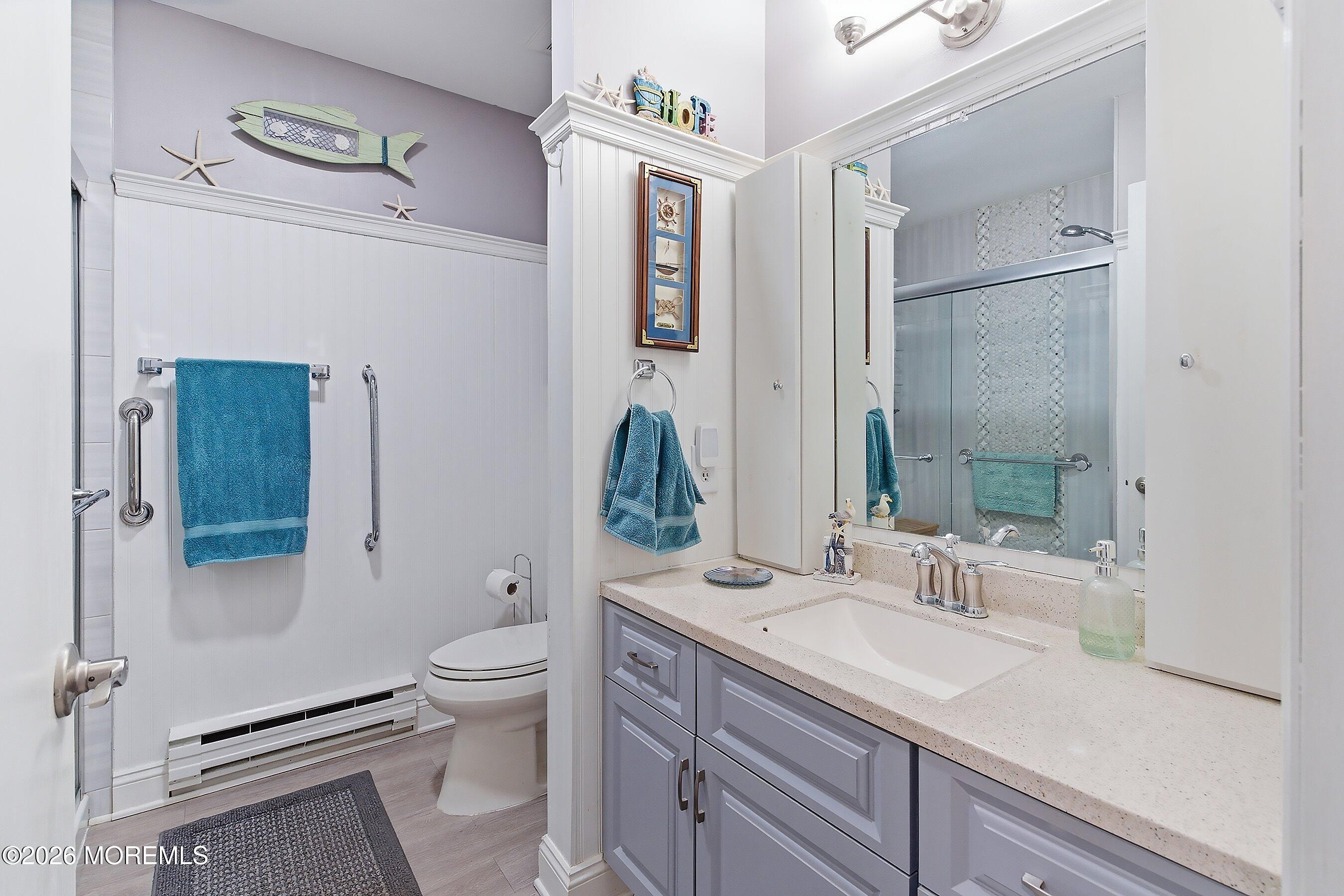 27 Amesbury Road, Unit 64 Whiting, NJ 08759 - Photo 33 of 50 a spacious bathroom with a sink a toilet and shower
