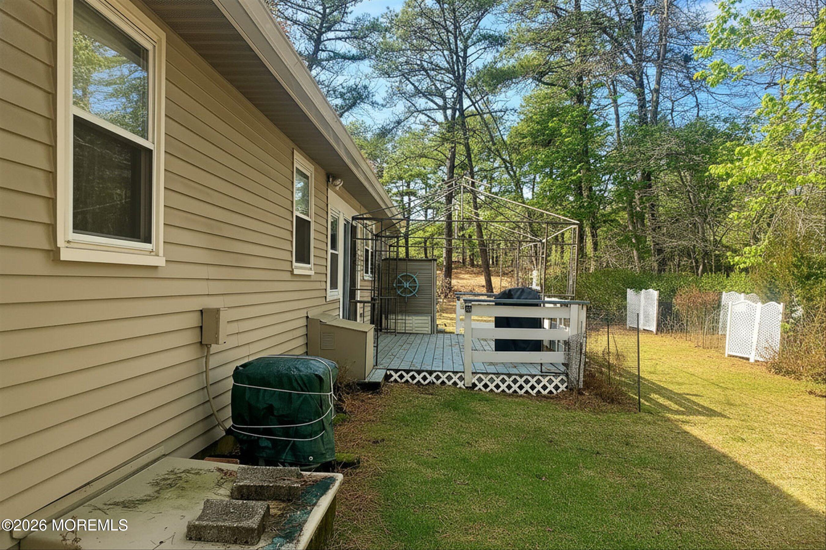 27 Amesbury Road, Unit 64 Whiting, NJ 08759 - Photo 38 of 50 a view of a backyard with sitting area