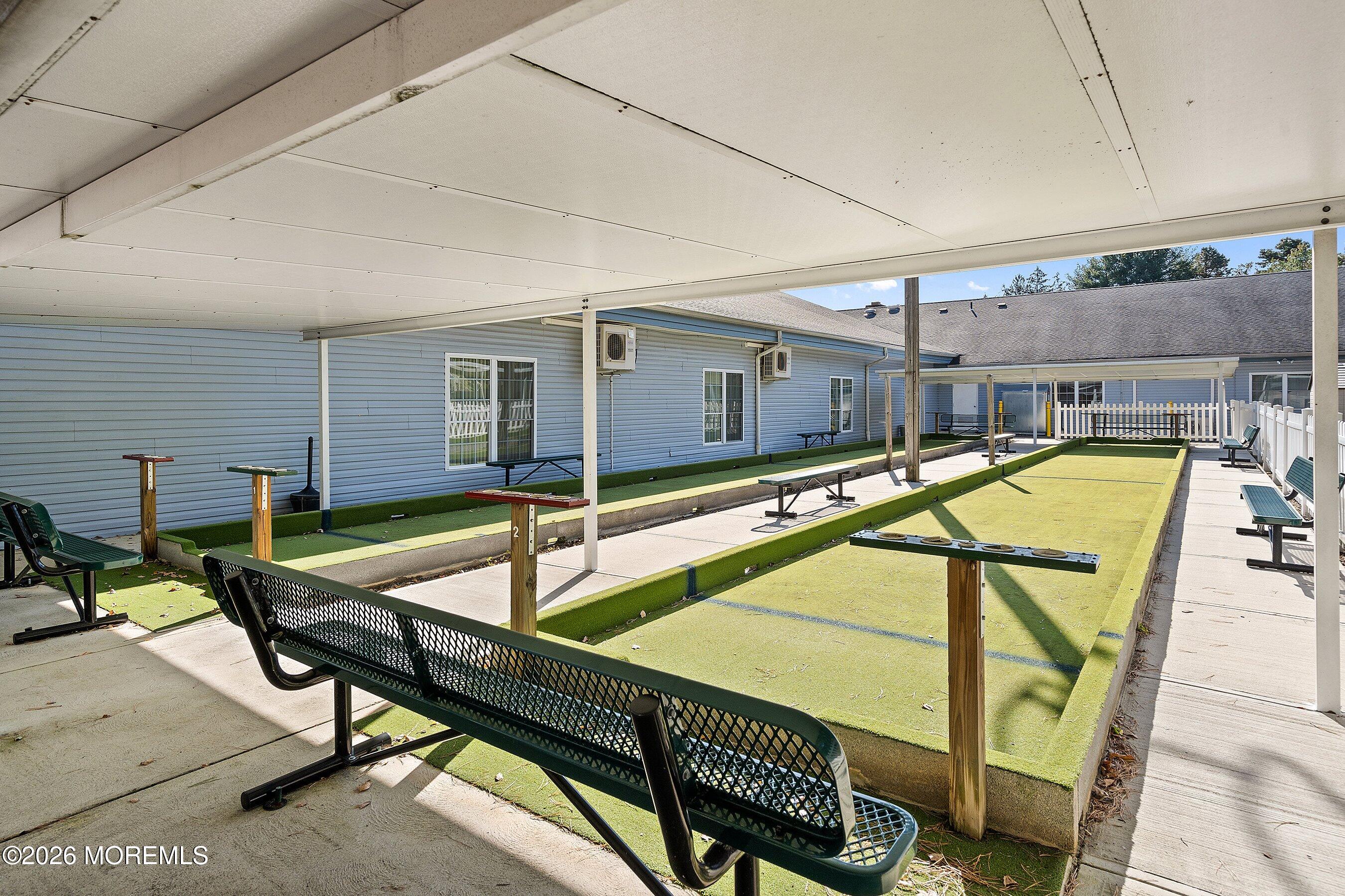 27 Amesbury Road, Unit 64 Whiting, NJ 08759 - Photo 46 of 50 a swimming pool with outdoor seating