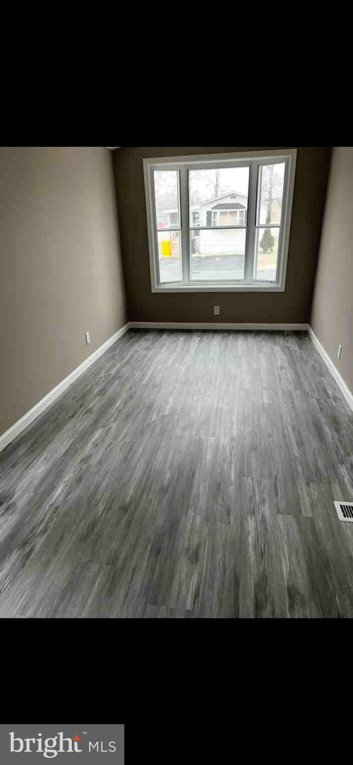 100 Lariat Road Middle River, MD 21220 - Photo 14 of 19 Bright and airy room with new flooring.