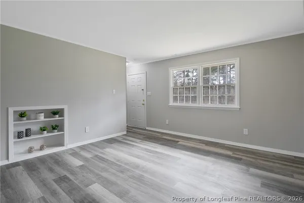 a view of kitchen with white cabinets