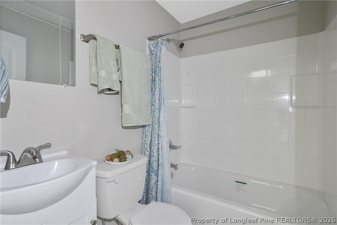 817 Ridge Road Fayetteville, NC 28311 - Photo 36 of 37 a bathroom with a sink a toilet and shower