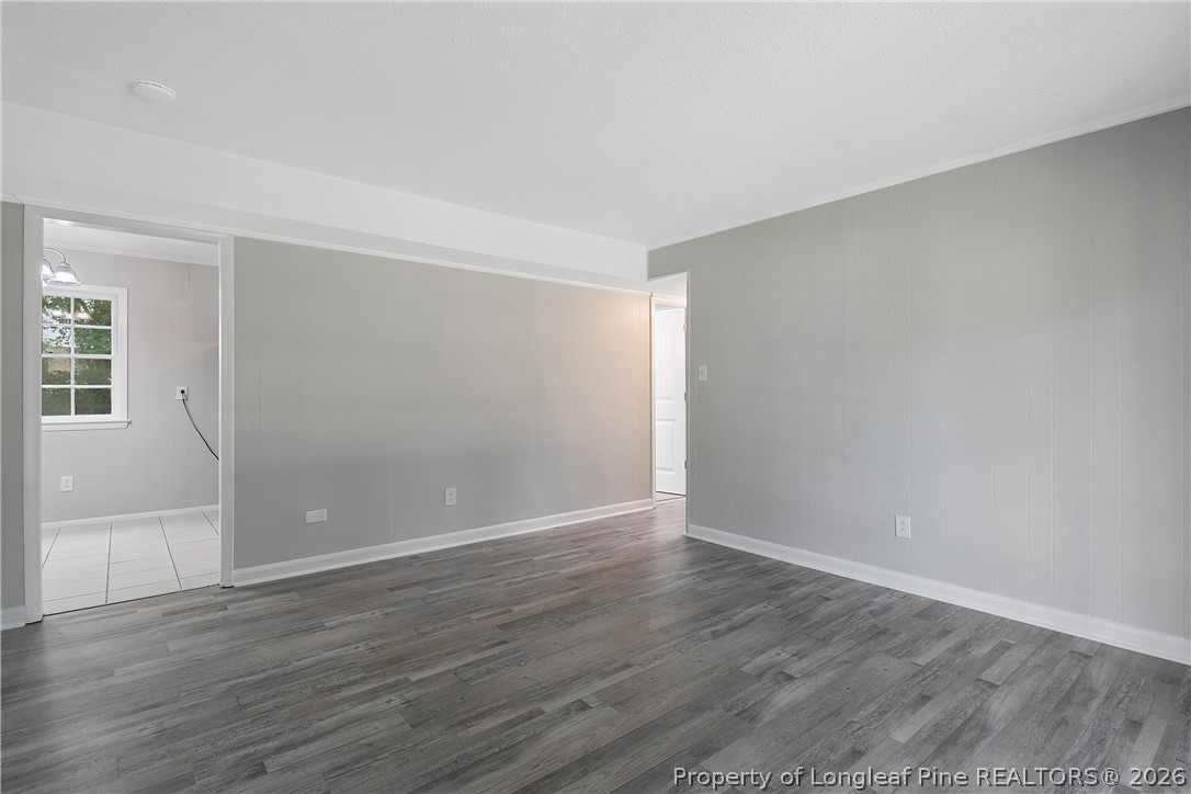 817 Ridge Road Fayetteville, NC 28311 - Photo 5 of 37 a view of an empty room with wooden floor and a window