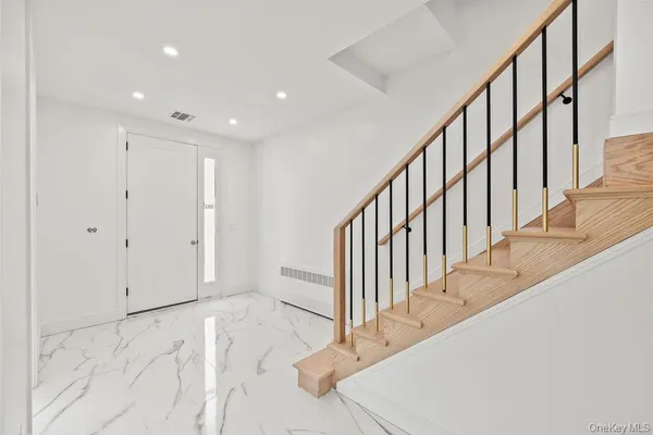 a view of a hallway with staircase