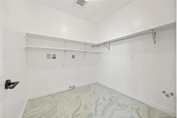 a view of a room with racks on the wall