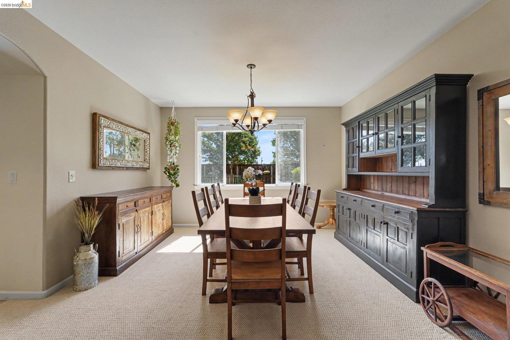 106 Little Ranch Circle Oakley, CA 94561 - Photo 4 of 34 Bright dining area featuring a chandelier and wall-to-wall carpeting