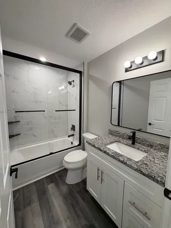 an empty room with staircase and a projector