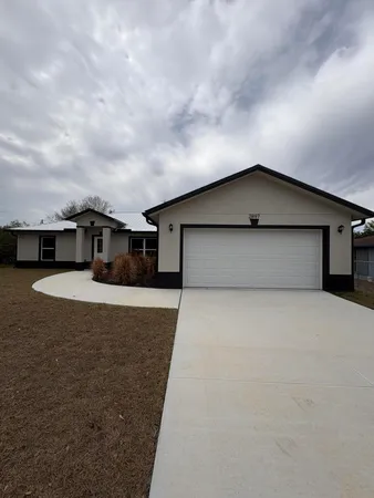 a view of a house with a garage