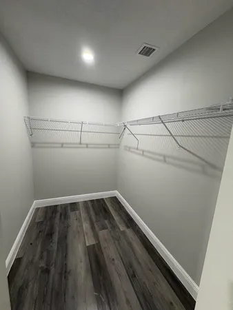 a view of a room with racks on the wall