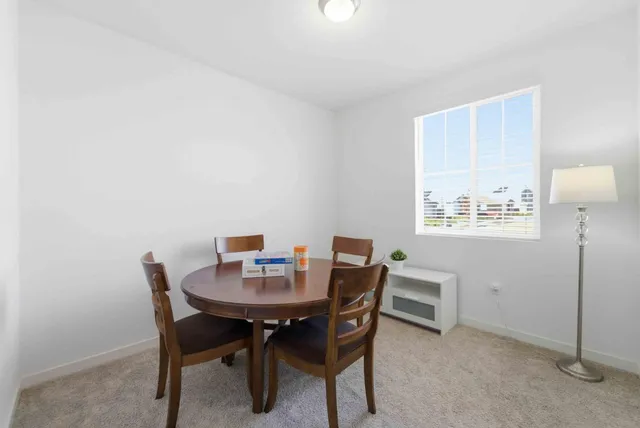 a view of a dining room with furniture