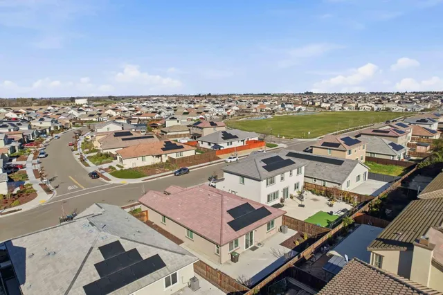 an aerial view of a city with ocean view