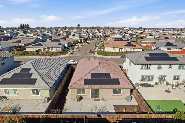 an aerial view of a city with lots of residential buildings