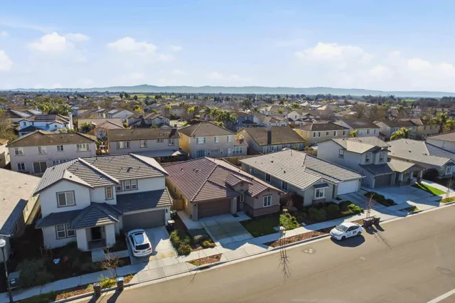 a aerial view of a houses with a city street