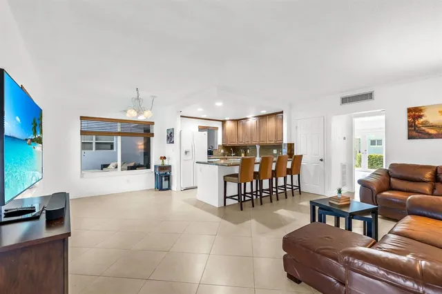 a kitchen with refrigerator cabinets and furniture