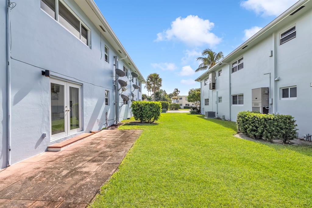 2835 Northeast 28th Avenue, Unit 3 Lighthouse Point, FL 33064 - Photo 24 of 30 a view of a back yard of the house