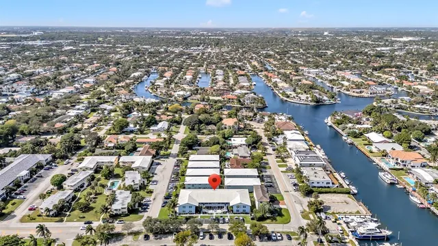 a view of a house with backyard porch and sitting area
