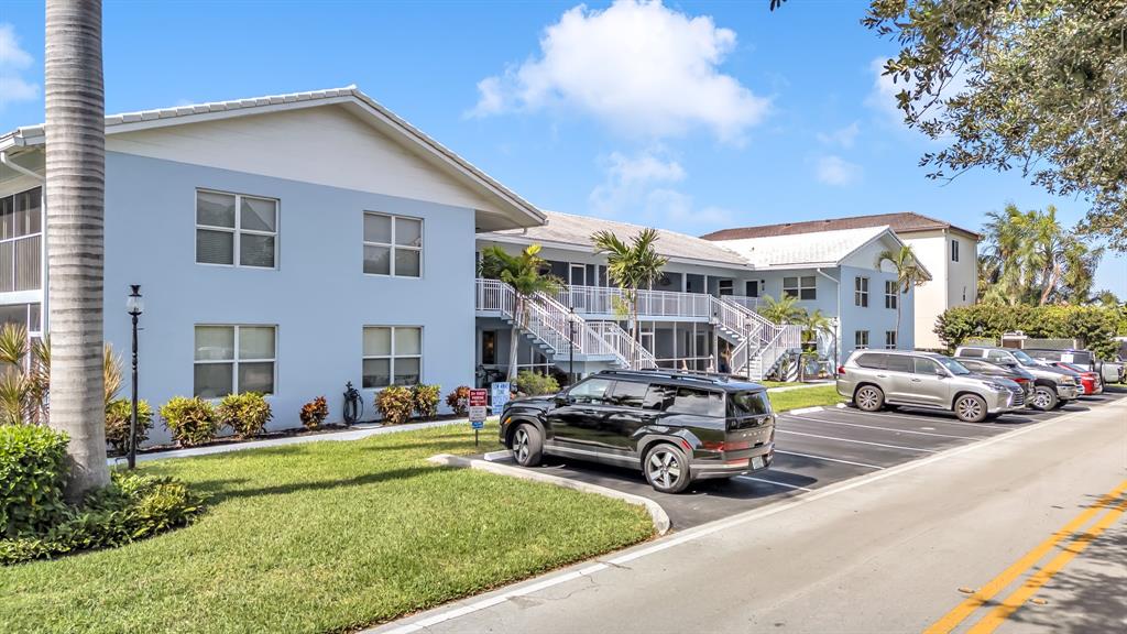 2835 Northeast 28th Avenue, Unit 3 Lighthouse Point, FL 33064 - Photo 4 of 30 a view of a house with backyard porch and sitting area