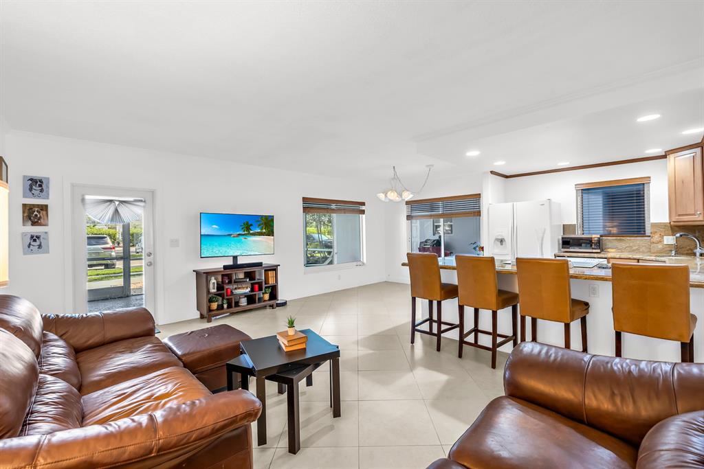 2835 Northeast 28th Avenue, Unit 3 Lighthouse Point, FL 33064 - Photo 9 of 30 a living room with furniture kitchen view and a window