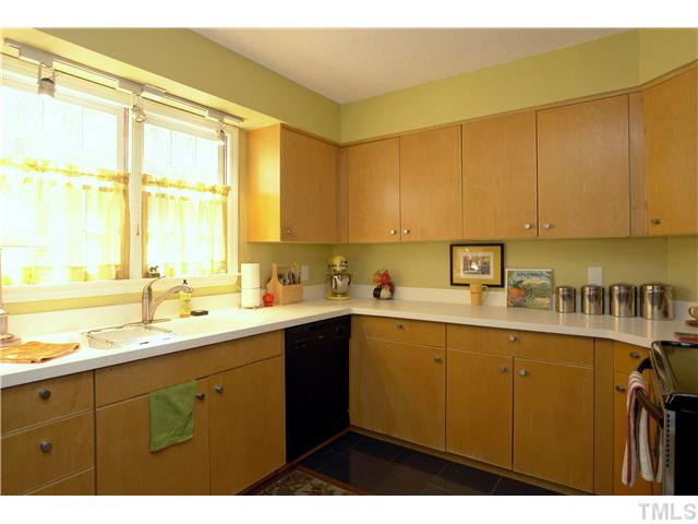 Kitchen features tons of cabinets, plus a pantry. All appliances included! Kitchen