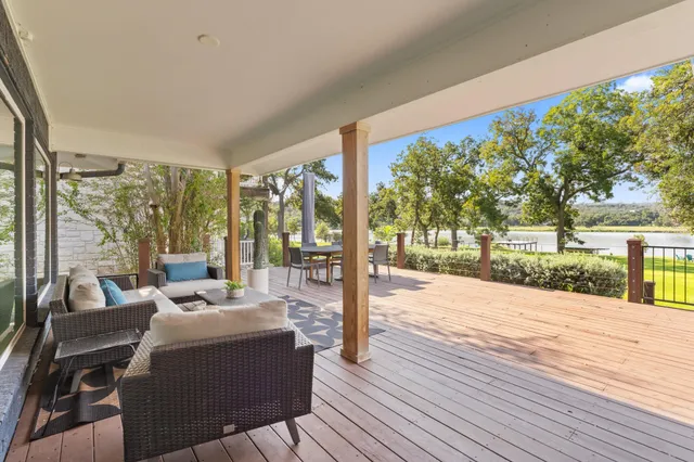 a house with swimming pool in front of it