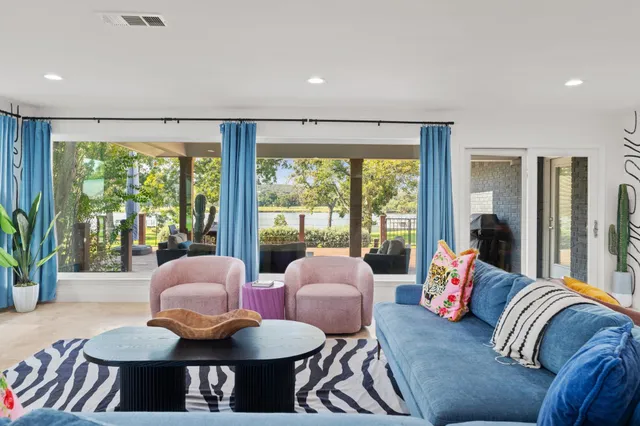 a view of a dining room with furniture and a window