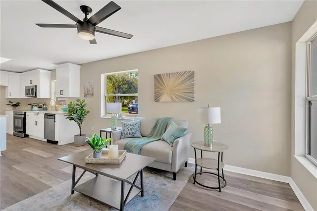a living room with furniture and a window