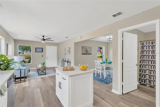 a view of living room with furniture and wooden floor