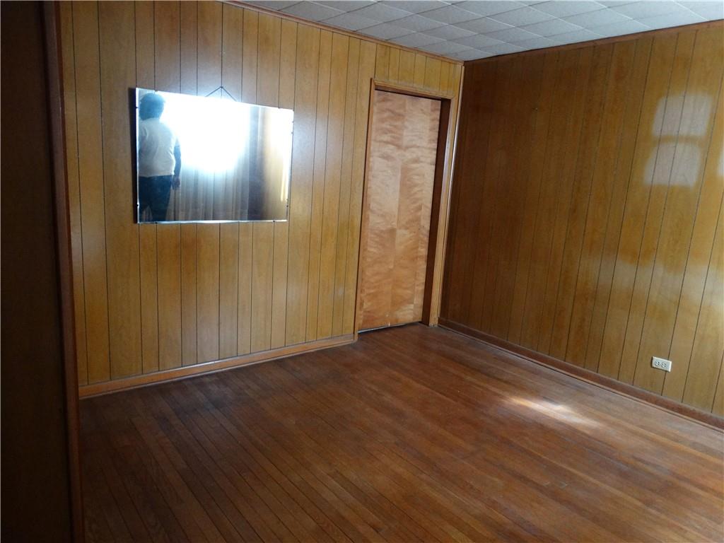 121 Cutler Street McKees Rocks, PA 15136 - Photo 10 of 17 an empty room with wooden floor and windows