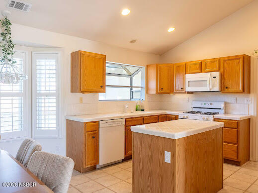 5011 Steeplegate Lane Santa Maria, CA 93455 - Photo 11 of 31 a kitchen with stainless steel appliances granite countertop a sink a stove a refrigerator cabinets and a window