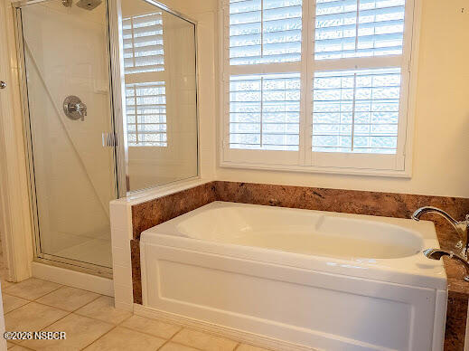 5011 Steeplegate Lane Santa Maria, CA 93455 - Photo 23 of 31 a bathroom with a bathtub and window