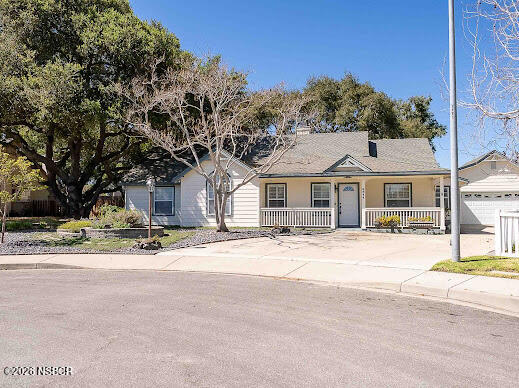5011 Steeplegate Lane Santa Maria, CA 93455 - Photo 3 of 31 a front view of a house with a yard and garage