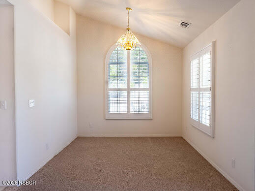 5011 Steeplegate Lane Santa Maria, CA 93455 - Photo 7 of 31 an empty room with windows and chandelier