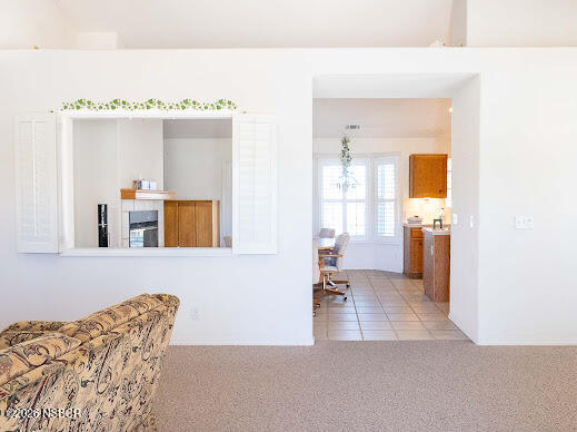 5011 Steeplegate Lane Santa Maria, CA 93455 - Photo 8 of 31 a living room with a couch and chandelier