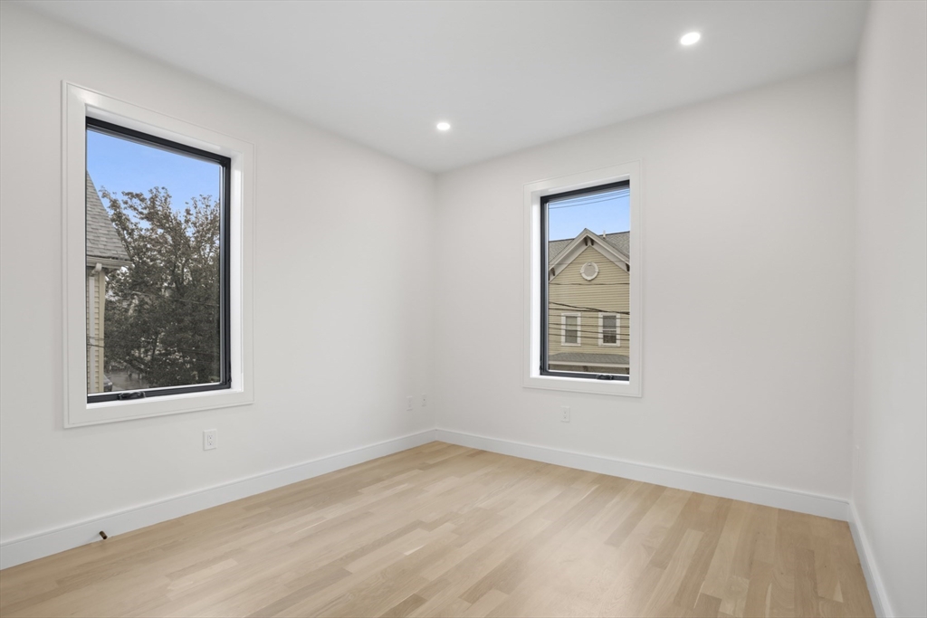 14 Bonair Street, Unit 14 Somerville, MA 02145 - Photo 14 of 39 an empty room with a window