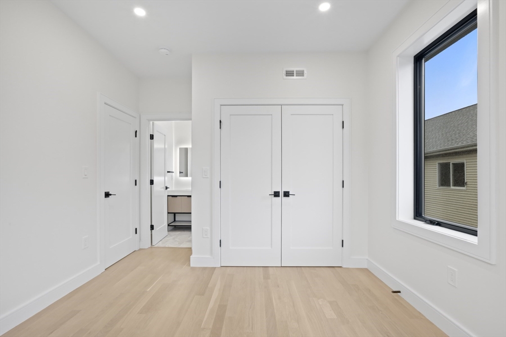 14 Bonair Street, Unit 14 Somerville, MA 02145 - Photo 15 of 39 a view of an empty room with closet and a window