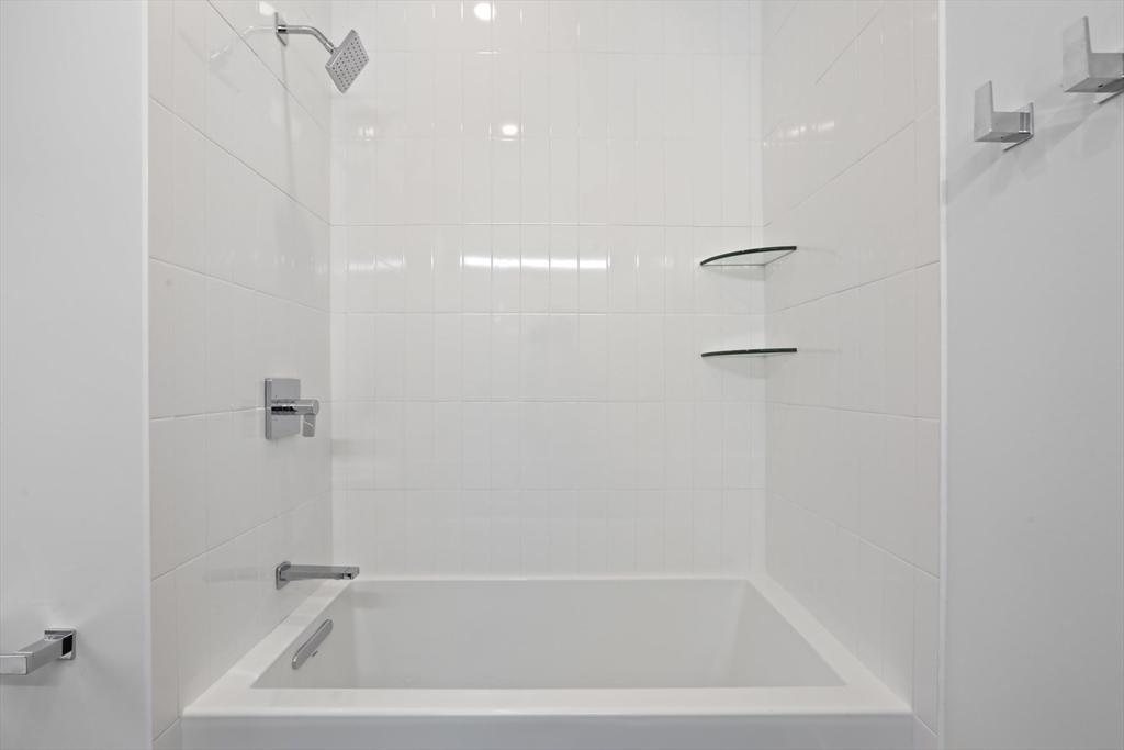 14 Bonair Street, Unit 14 Somerville, MA 02145 - Photo 24 of 39 a close view of a bathtub in bathroom