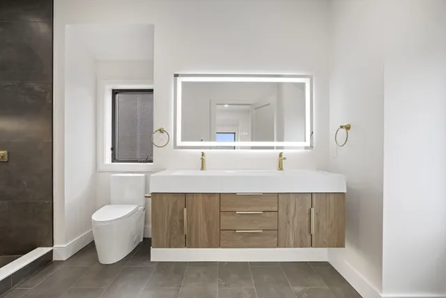 a bathroom with a shower and a toilet