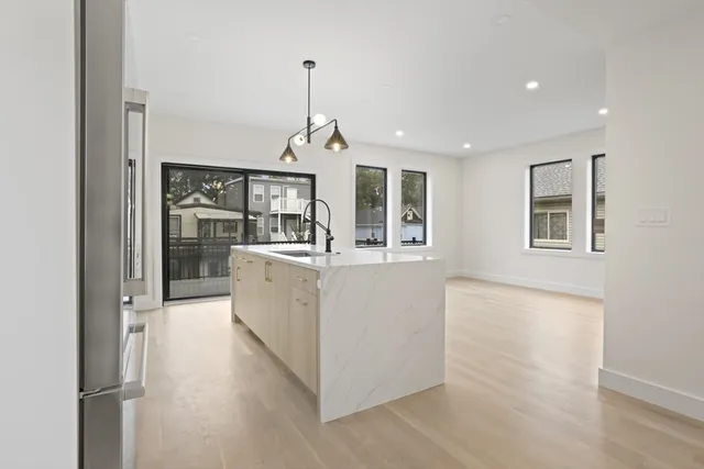a view of a kitchen with a sink