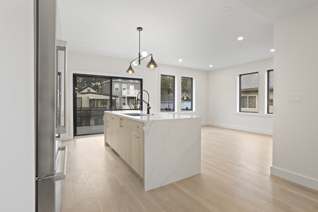 14 Bonair Street, Unit 14 Somerville, MA 02145 - Photo 3 of 39 a view of a kitchen with a sink