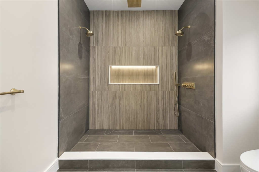 14 Bonair Street, Unit 14 Somerville, MA 02145 - Photo 32 of 39 a bathroom with a shower and a toilet