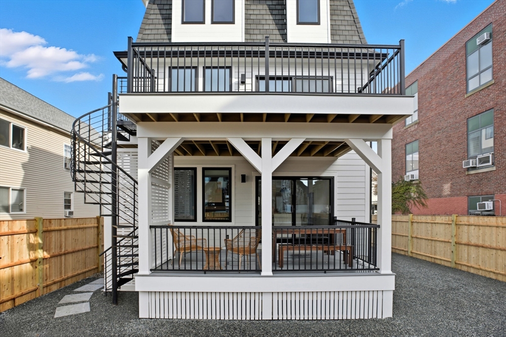 14 Bonair Street, Unit 14 Somerville, MA 02145 - Photo 35 of 39 a view of a house with a wooden deck