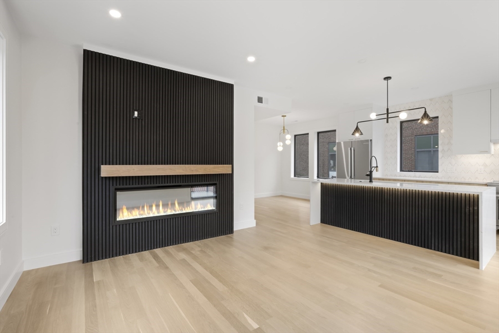 14 Bonair Street, Unit 14 Somerville, MA 02145 - Photo 9 of 39 a view of kitchen with refrigerator and yard