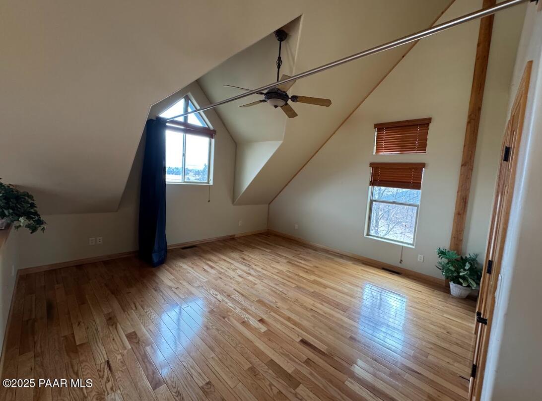 1740 West Bumblebee Road Chino Valley, AZ 86323 - Photo 13 of 44 an empty room with wooden floor and windows